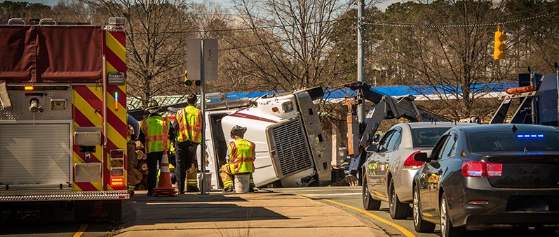 A truck accident in Denver, CO with the paramedics on scene.