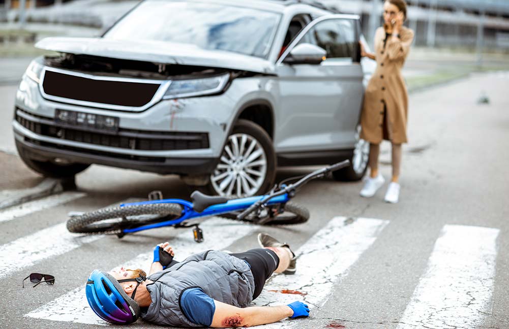 A biker hit by an SUV at an intersection in Denver, CO.